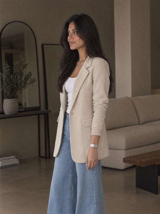 Beige SeamFlex Blazer, side view showing the sleeve and mid-thigh length