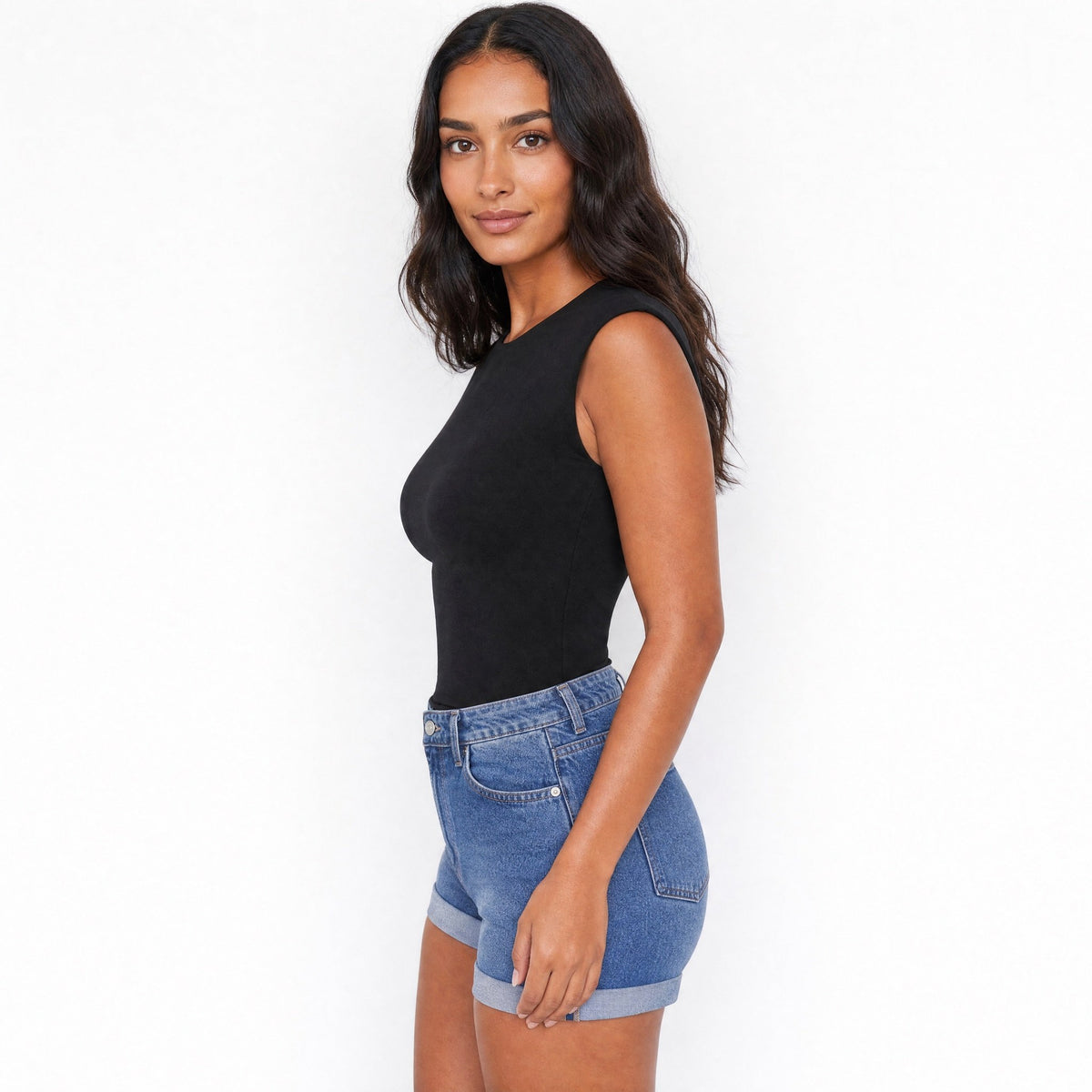 SeamSoft Round Neck Top in black, side view showing the fitted silhouette